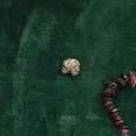 The Pyrite represents non-financial wealth